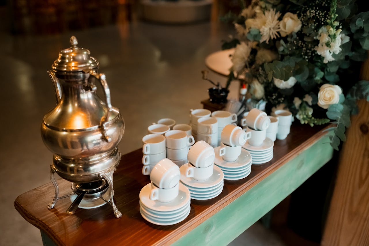 Elegant Silver Teapot and Teacups Set on Table